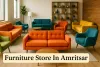 Colorful designer furniture in a modern Amritsar showroom with vibrant sofas, armchairs, and elegant wooden decor.