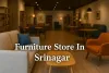 Modern furniture store in Srinagar with colorful sofas, chairs, and wooden tables in a cozy, well-lit interior.