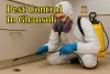 Pest control expert spraying cockroach in Ghansoli kitchen with bold yellow shadowed text and protective gear.